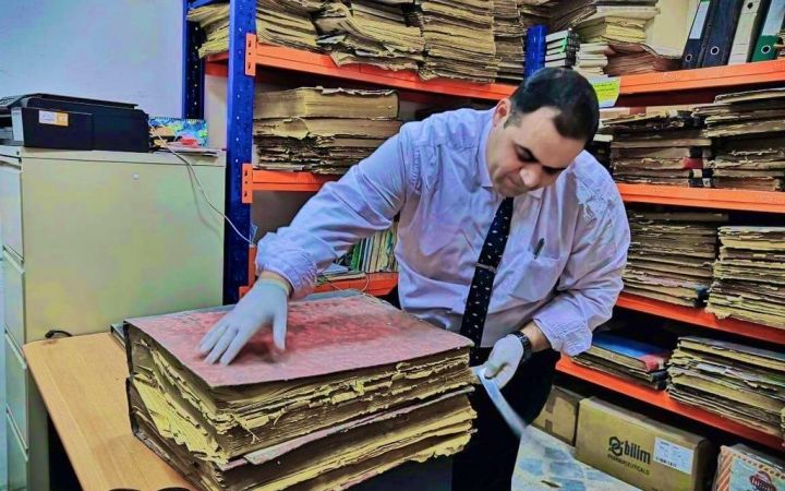 Sayf Al Ashqar is working on book restoration.